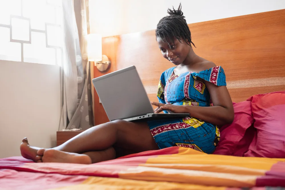 photo of a student working from home with comfortable chair